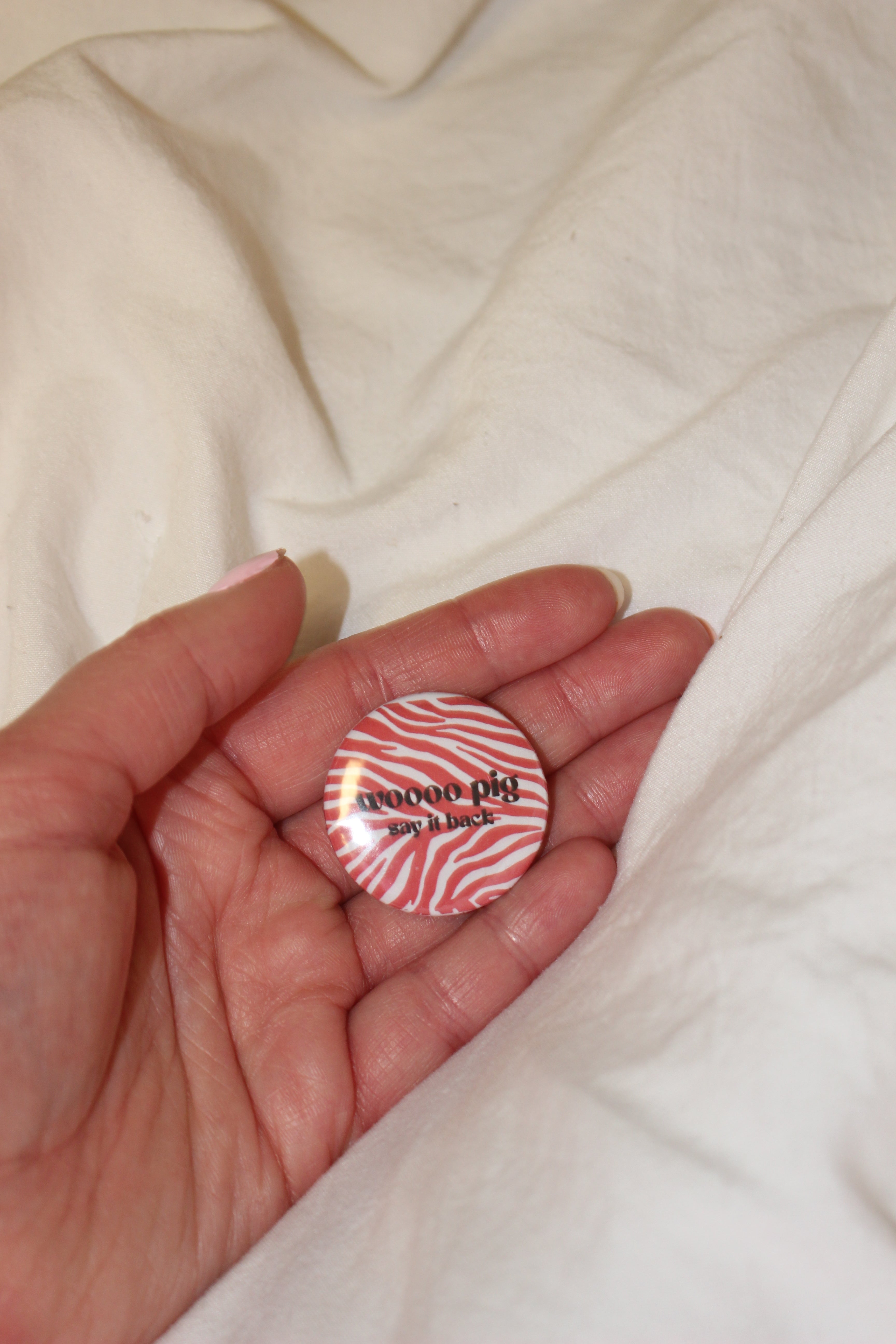 "woo pig say it back" red zebra print button